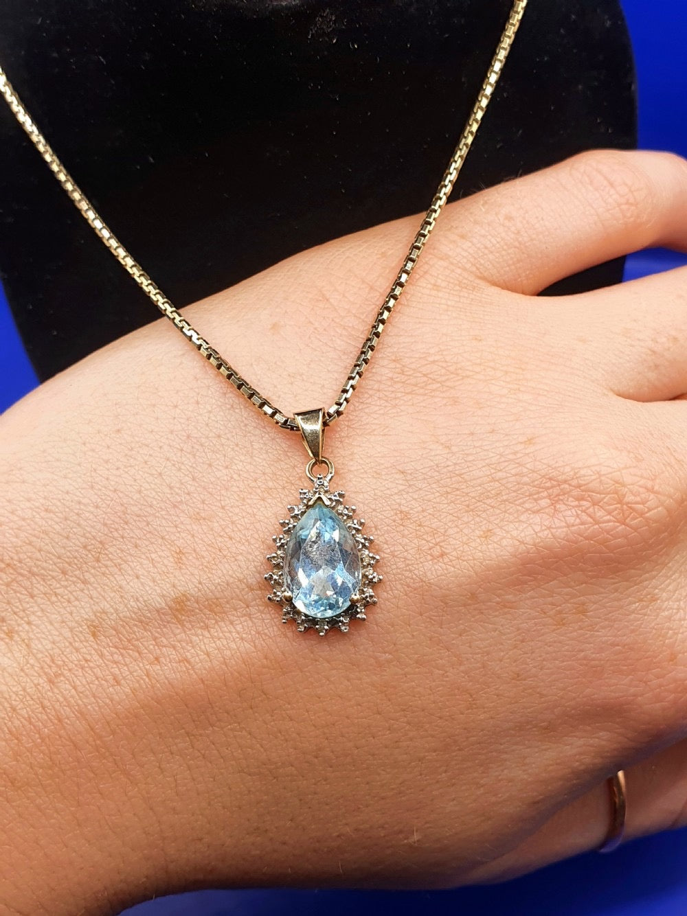Pear Cut Blue Topaz With Diamond Halo on 9ct Gold Pendant