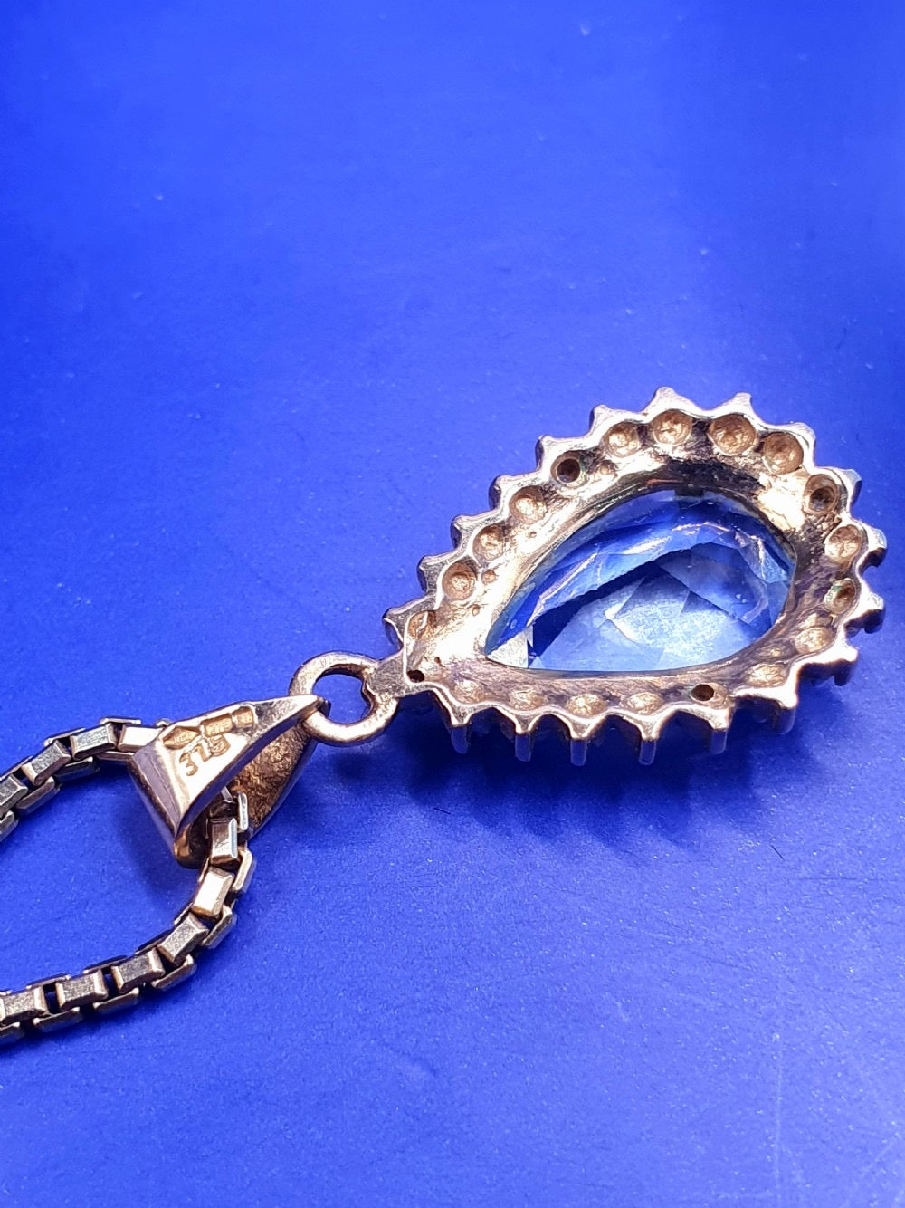 Pear Cut Blue Topaz With Diamond Halo on 9ct Gold Pendant