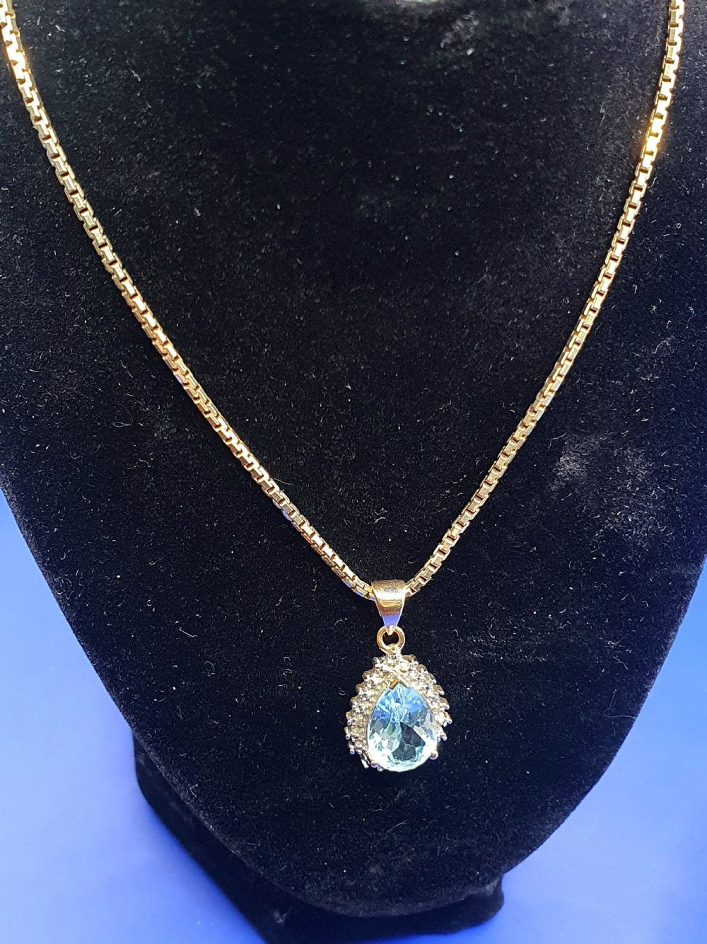 Pear Cut Blue Topaz With Diamond Halo on 9ct Gold Pendant